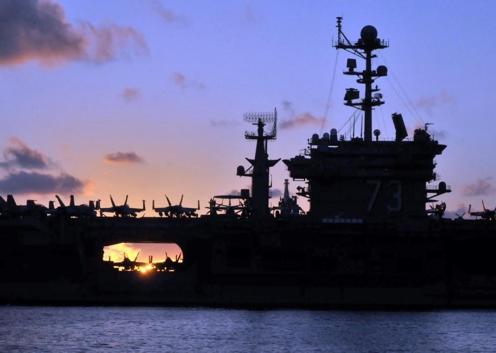 Free Image of Large Ship Sailing in Water at Sunset 