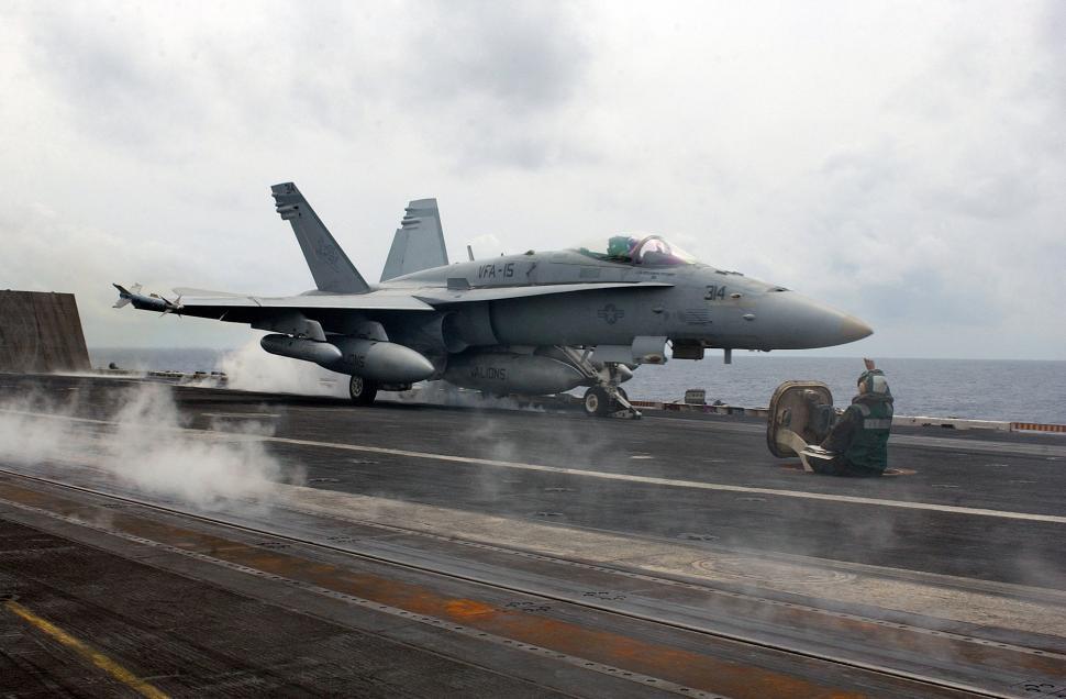 Free Image of Fighter Jet Parked on Aircraft Carrier 