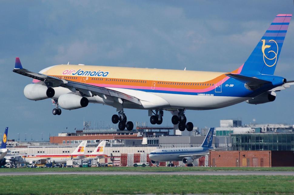 Free Image of Large Jetliner Taking Off From Airport Runway 