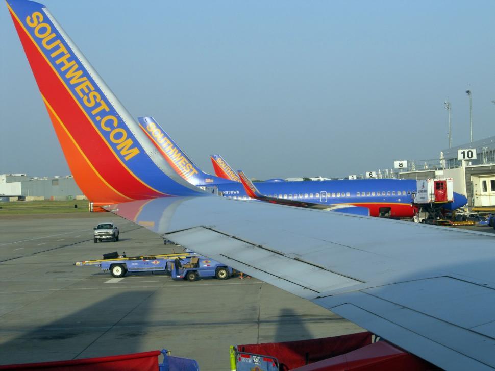 Free Image of Large Jetliner Parked on Airport Tarmac 