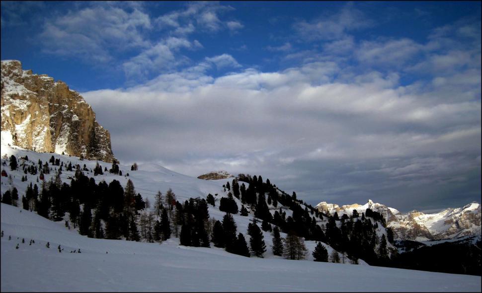Free Image of Snow Covered Mountain Under Cloudy Blue Sky 