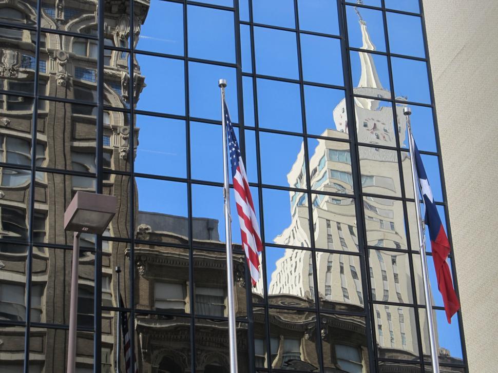 Free Image of Reflecting Building in Glass Window 