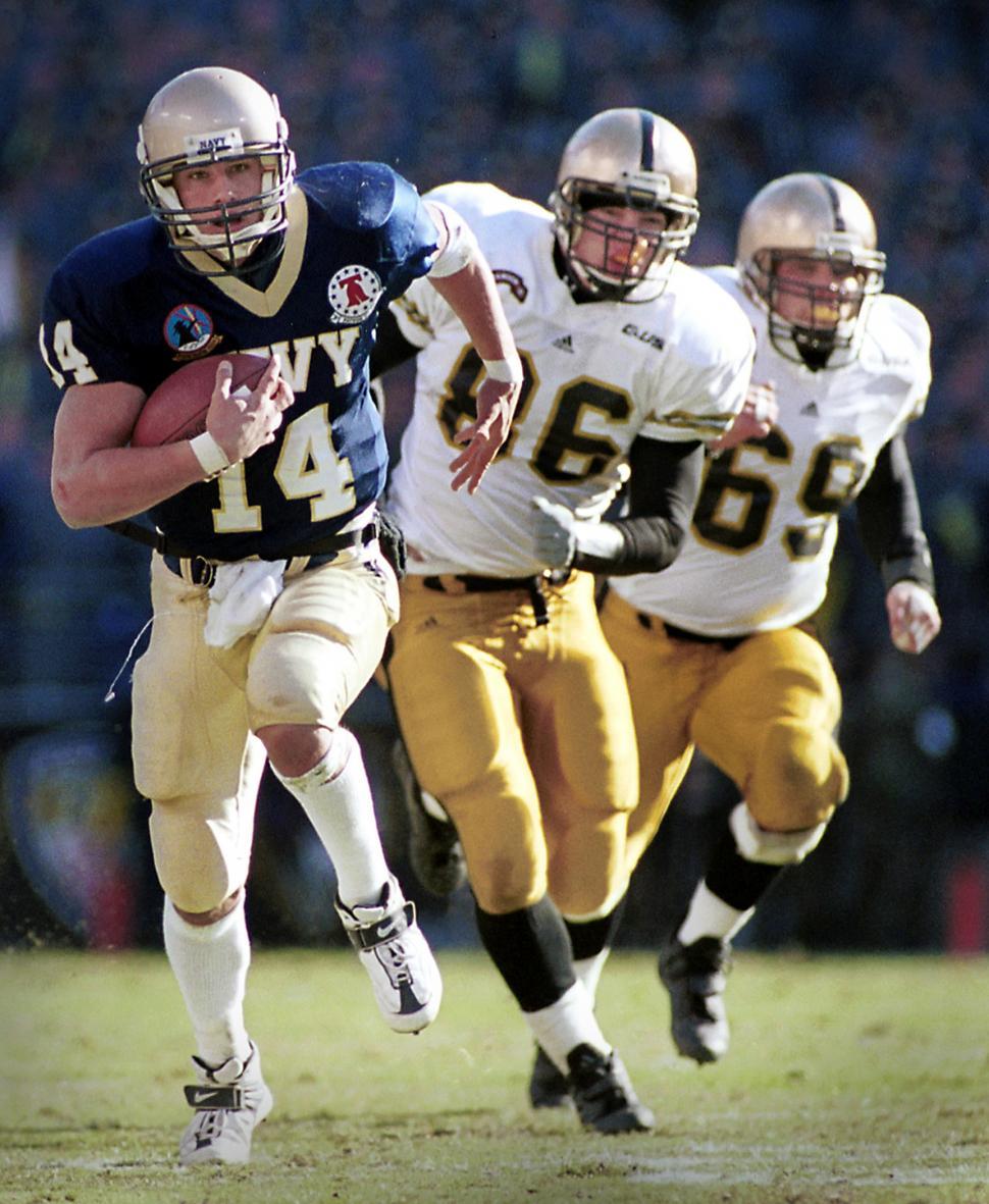 Free Image of Football Player Running With the Ball During a Game 