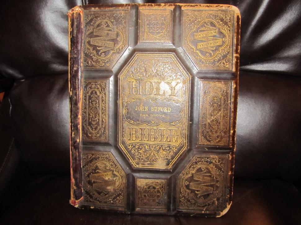 Free Image of Old Book Resting on Leather Chair 