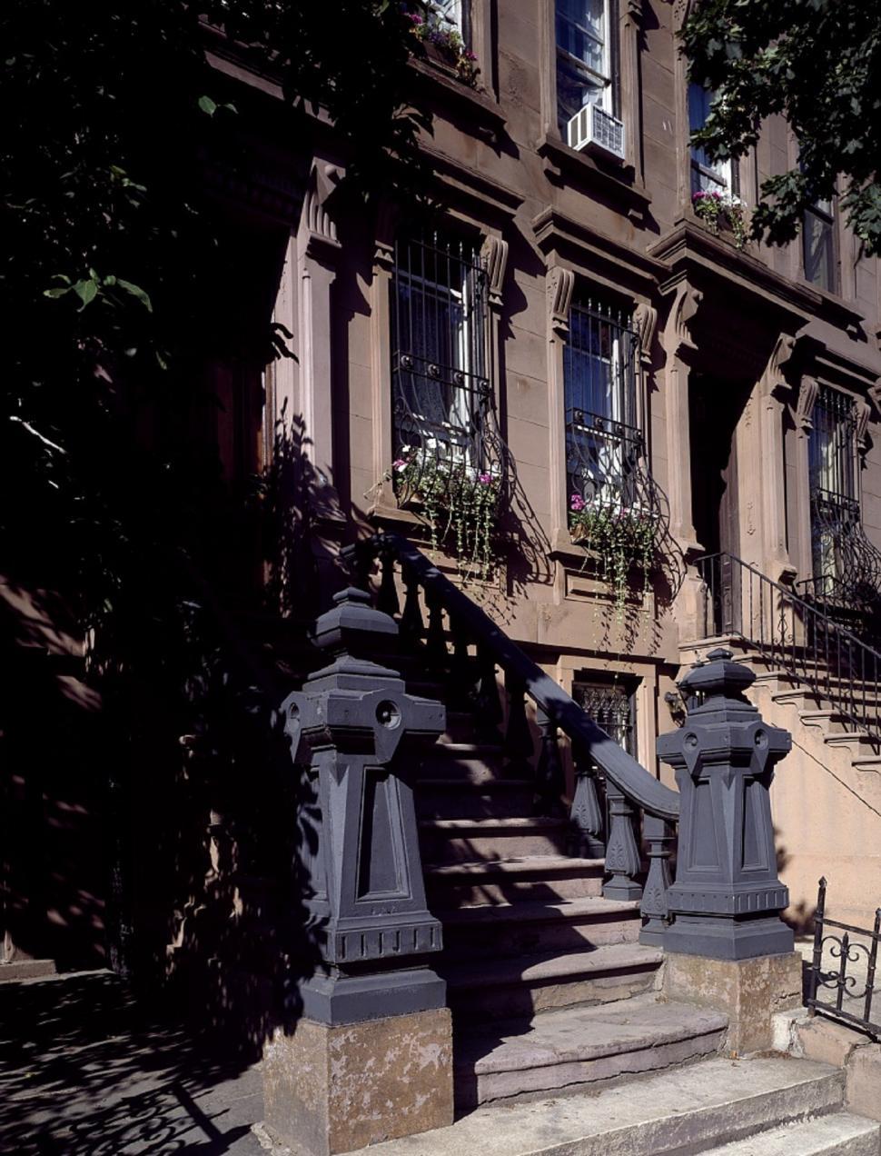 Free Image of Large Building With Many Windows and Stairs 