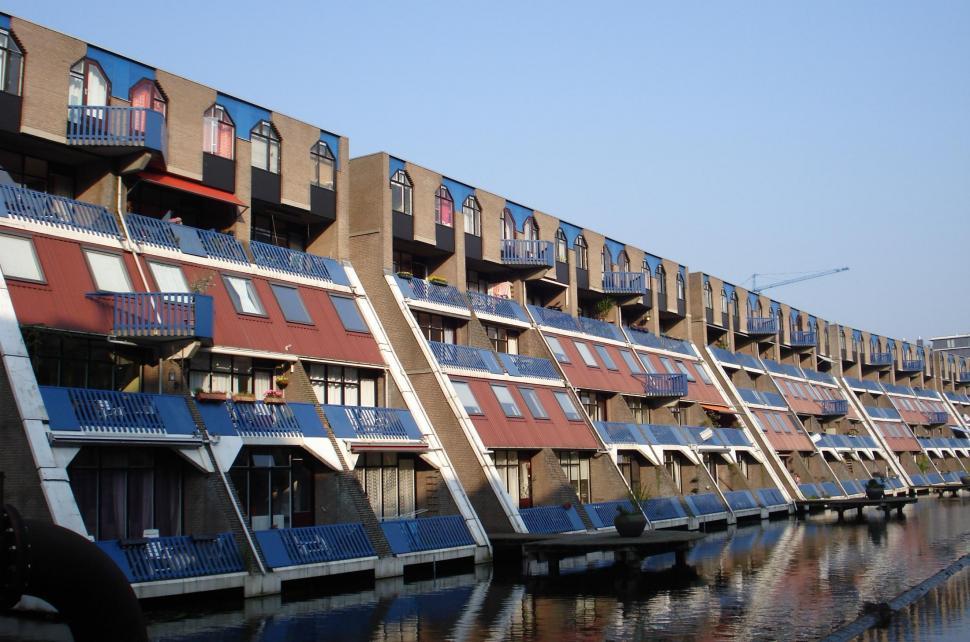 Free Image of Row of Buildings by Waterfront 