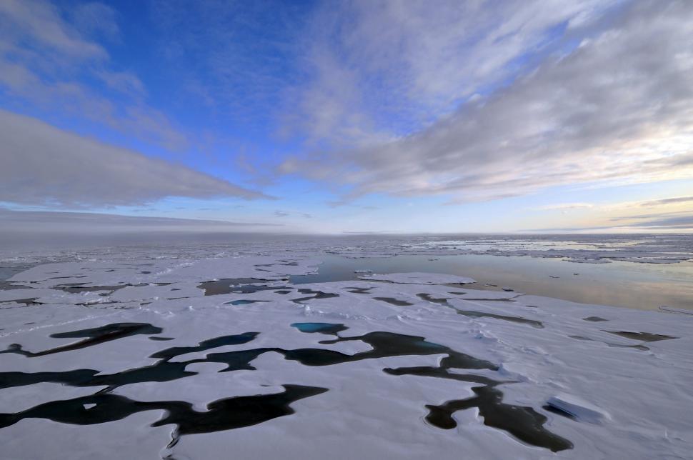 Free Image of Snow Covered Ground Under a Cloudy Sky 