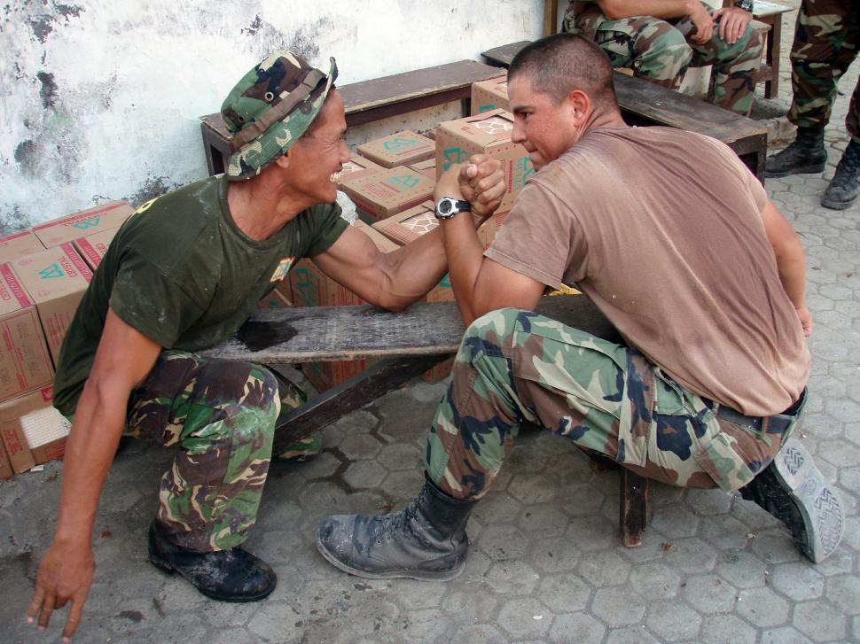 Free Image of Two Men Sitting on Top of a Wooden Bench 