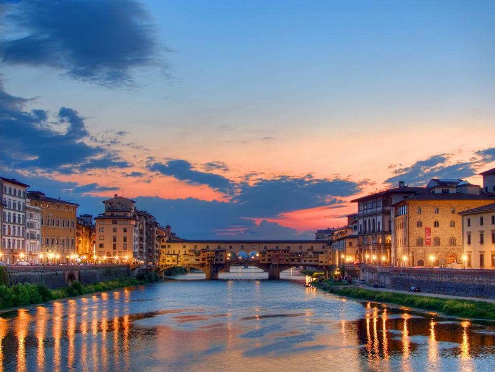 Free Image of River Flowing Through City Amidst Tall Buildings 