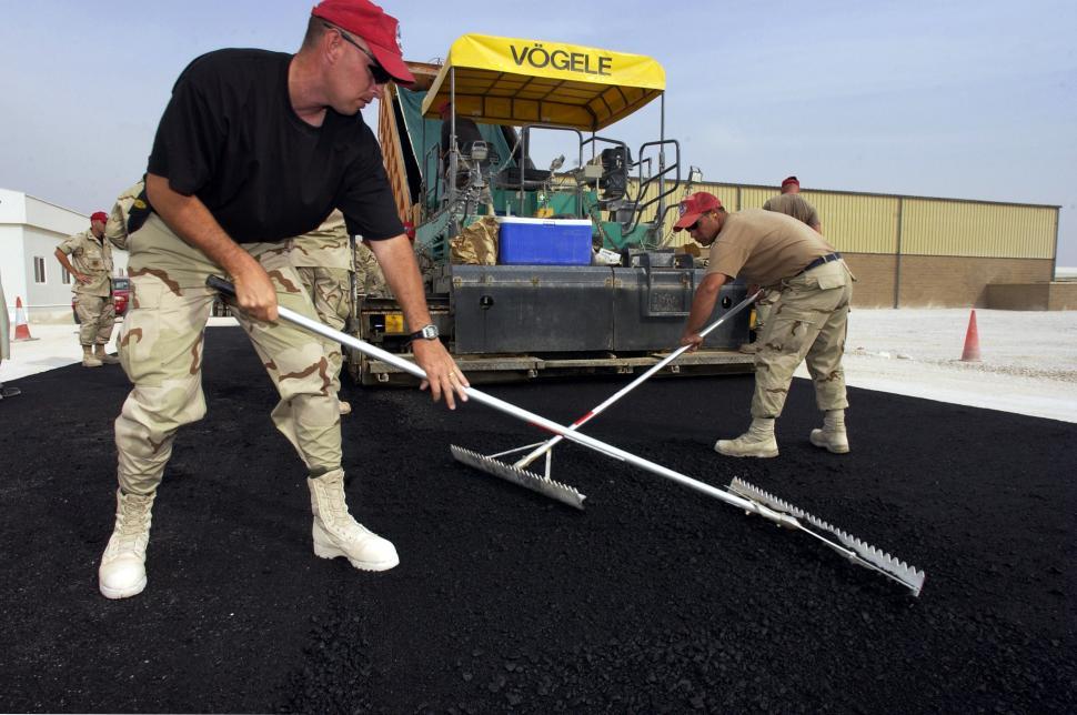 Free Image of Two Men Standing in Dirt 