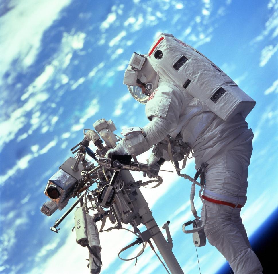 Free Image of Astronaut Standing on Top of Space Station 