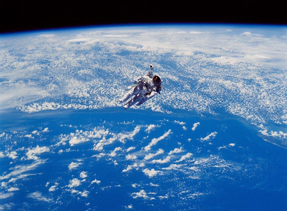 Free Image of Astronaut Floating Above Earth 