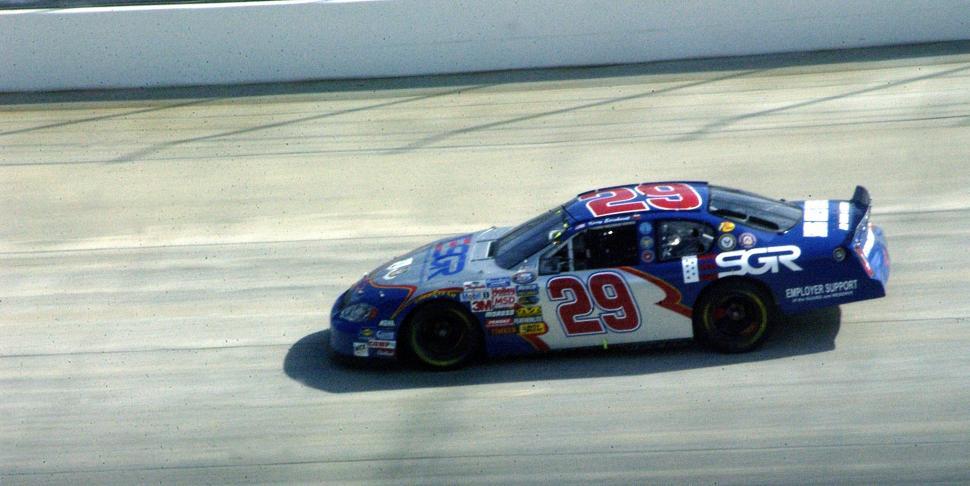 Free Image of Person Driving Race Car on Track 
