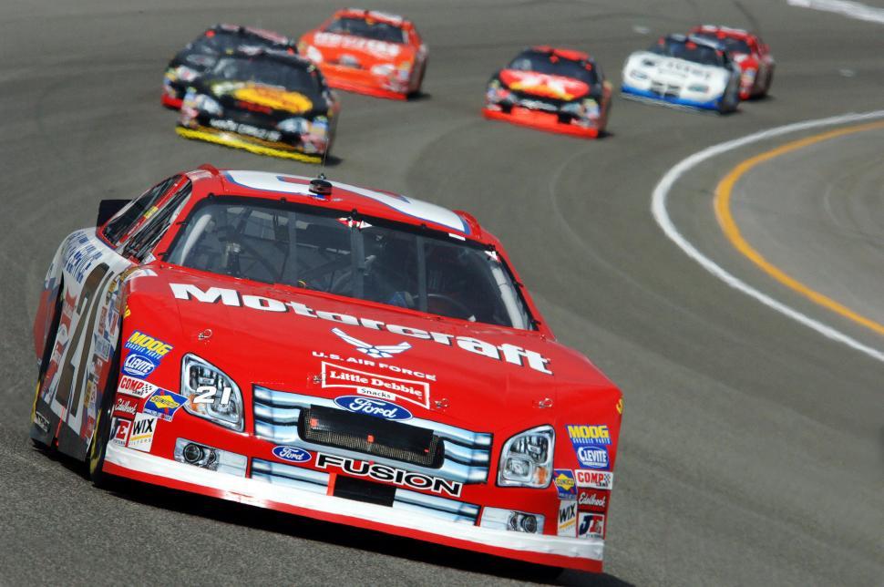 Free Image of Cars Racing Around Track 