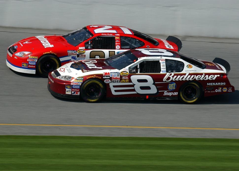 Free Image of Two Racing Cars Speeding on Race Track 