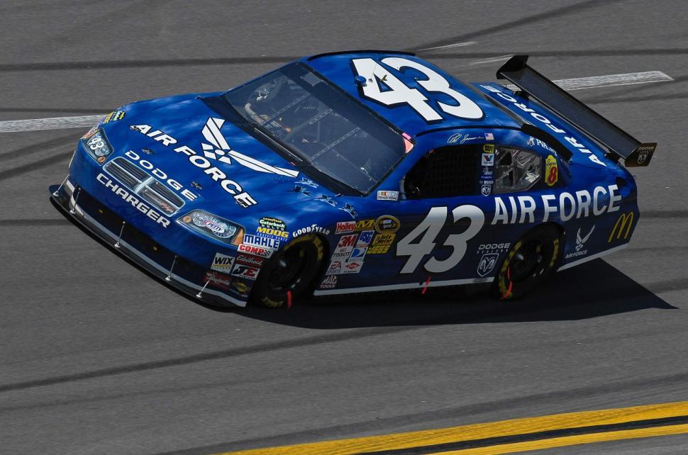 Free Image of Blue Car Speeding Along Race Track 