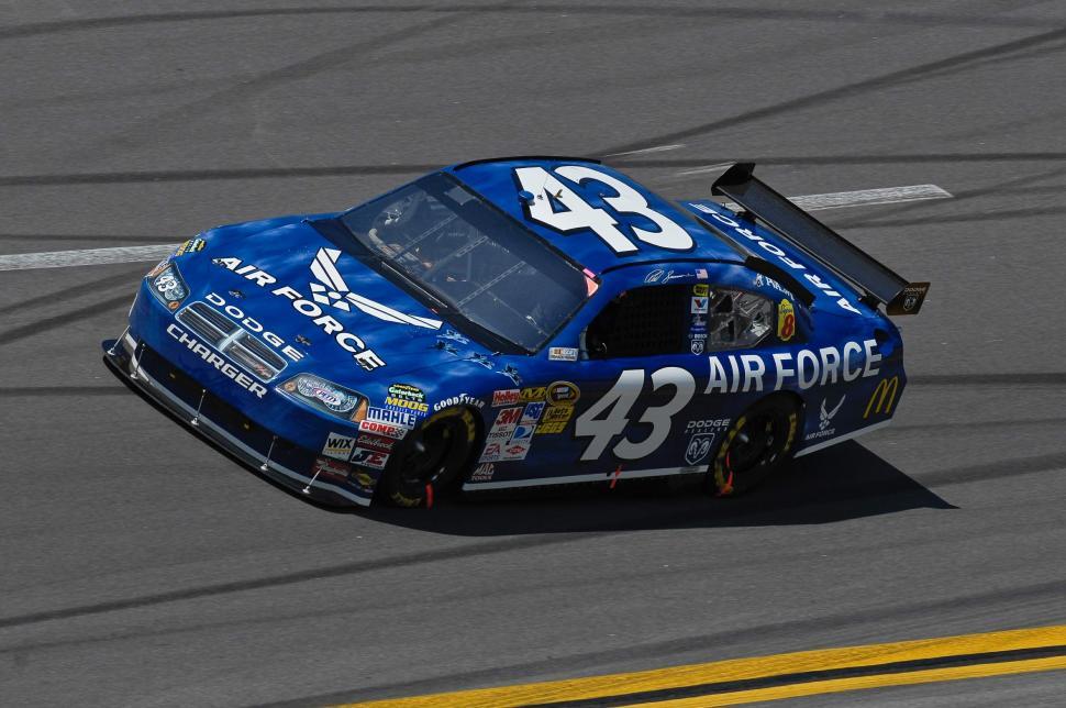 Free Image of Blue Race Car Speeding Down Race Track 
