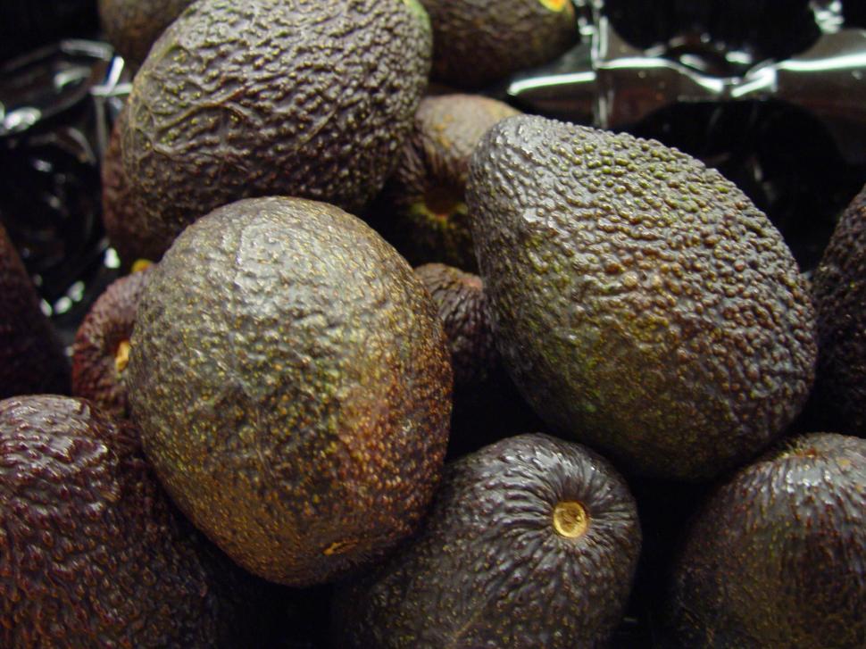 Free Image of A Pile of Avocados Sitting Next to Each Other 
