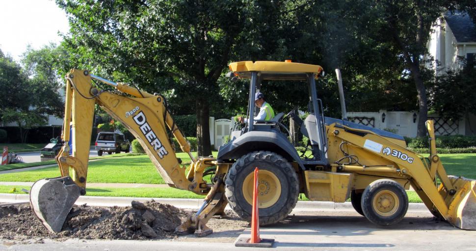 Free Image of Large Yellow Bulldozer Parked Next to Road 