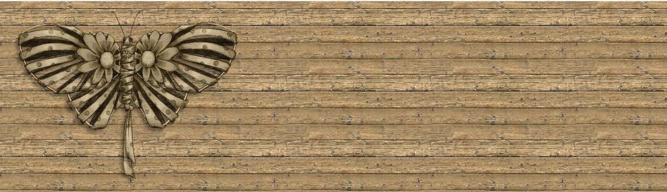 Free Image of Butterfly Drawing on Wooden Surface 