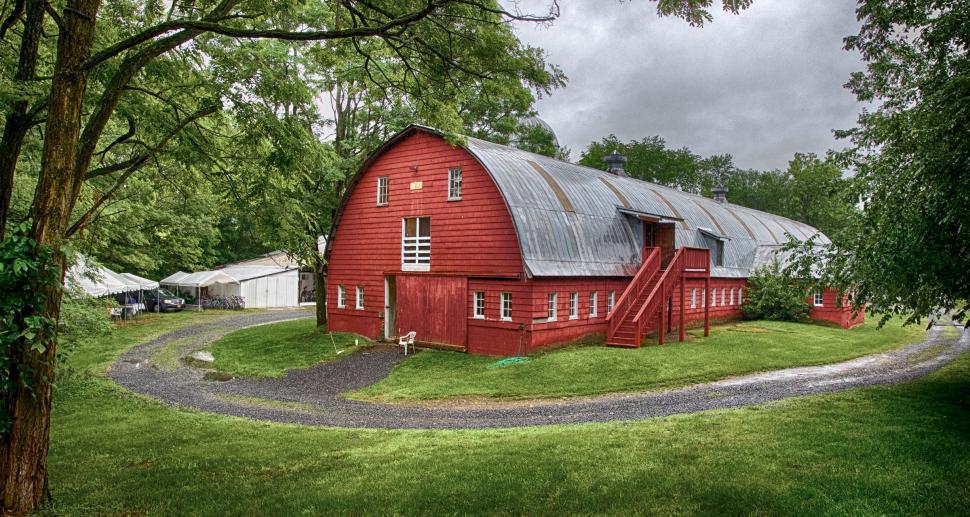 Free Image of Large Red Barn on Lush Green Field 