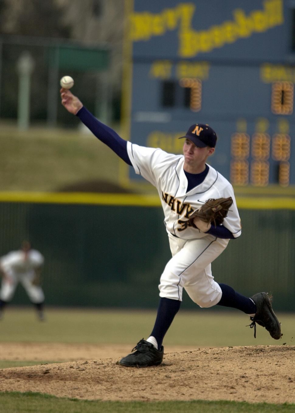 Free Image of Baseball Player Pitching Ball on Field 