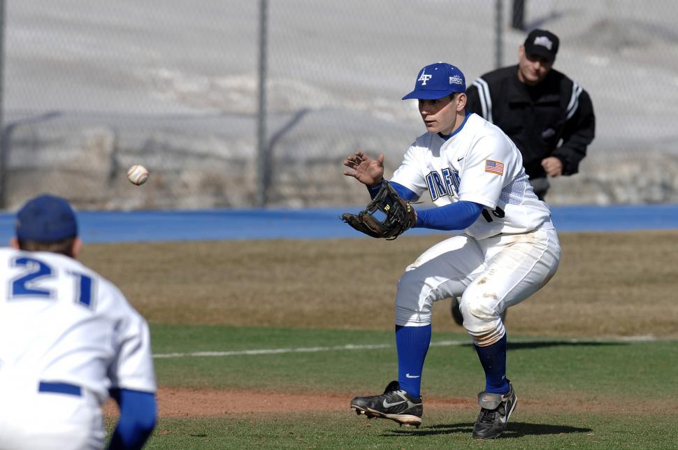 Free Image of Baseball Player Throwing Ball on Field 