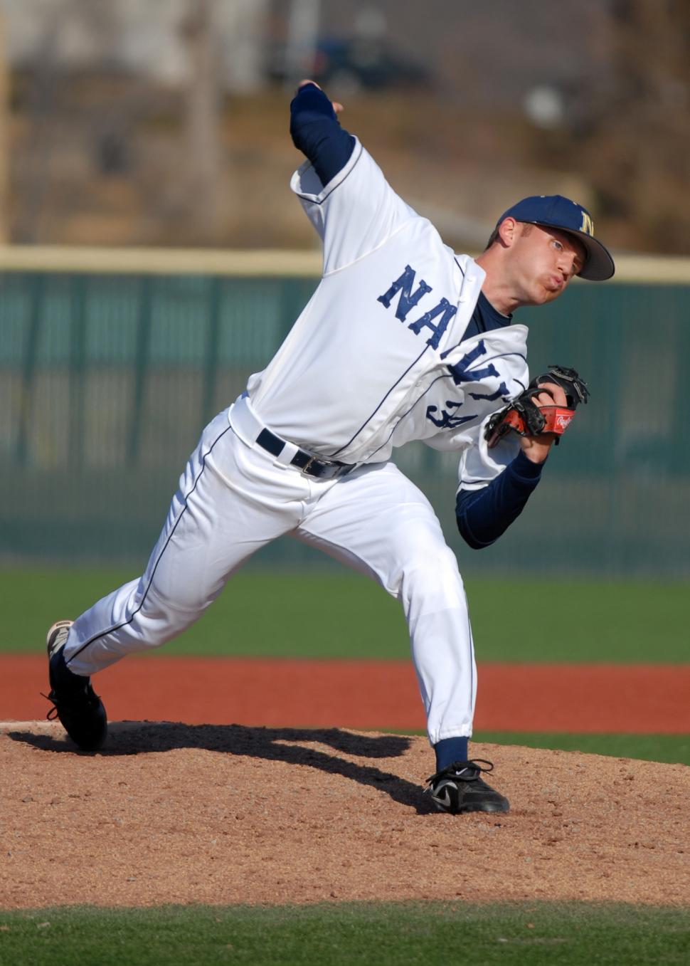 Free Image of Baseball Player Pitching Ball on Field 