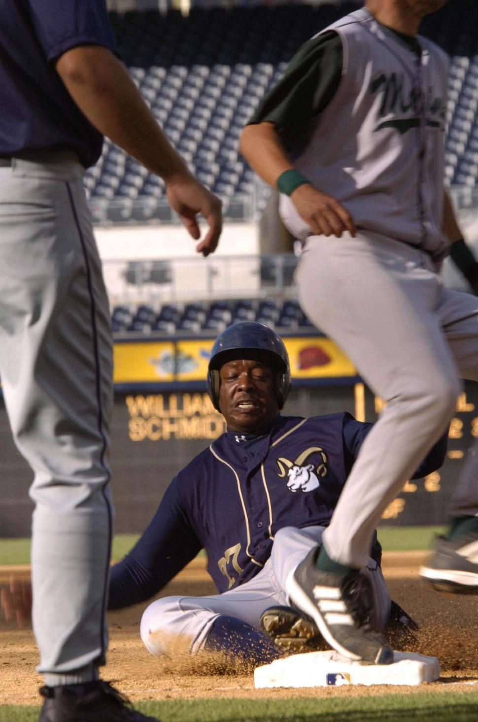 Free Image of Baseball Player Sliding Into Base 