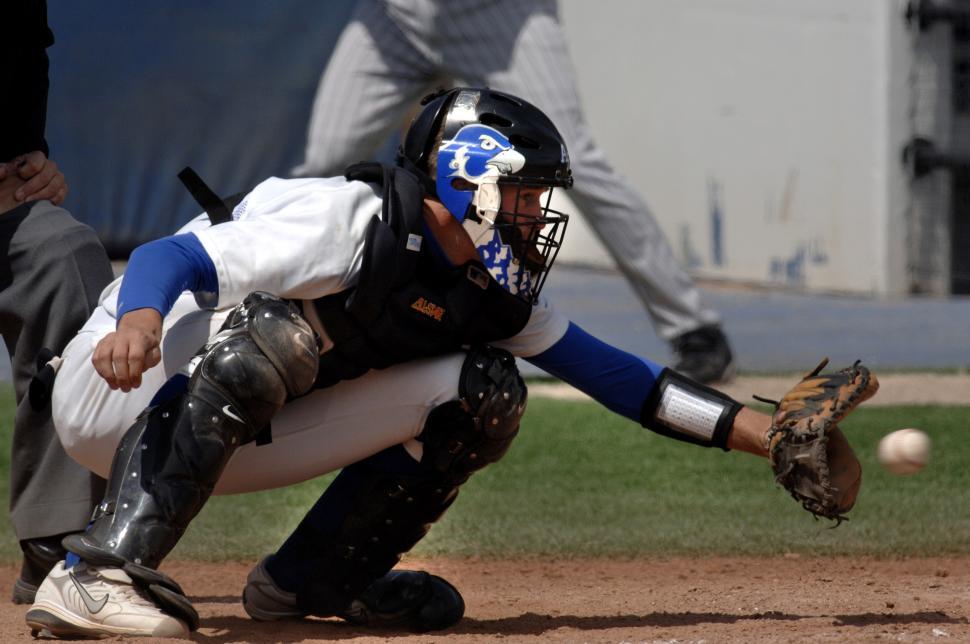 Free Image of Baseball Player Catching a Ball With His Glove 