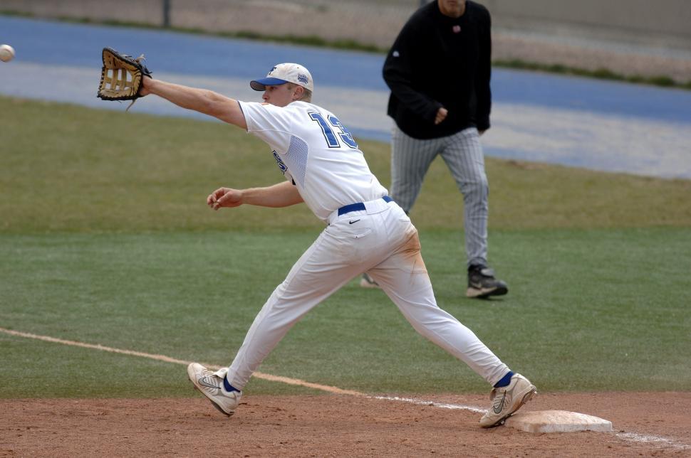 Free Image of Baseball Player Throwing Ball on Field 
