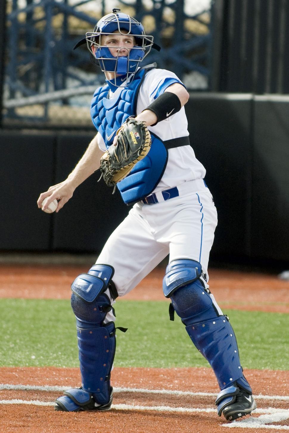 Free Image of Baseball Player Holding Catchers Mitt on Field 