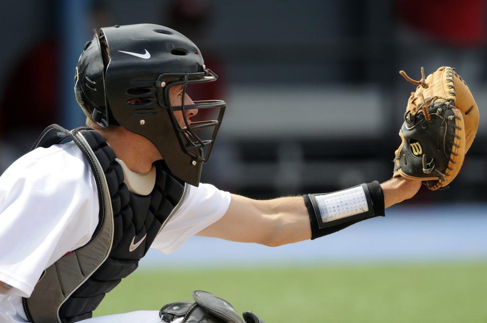 Free Image of Baseball Player Holding Catchers Mitt on Field 