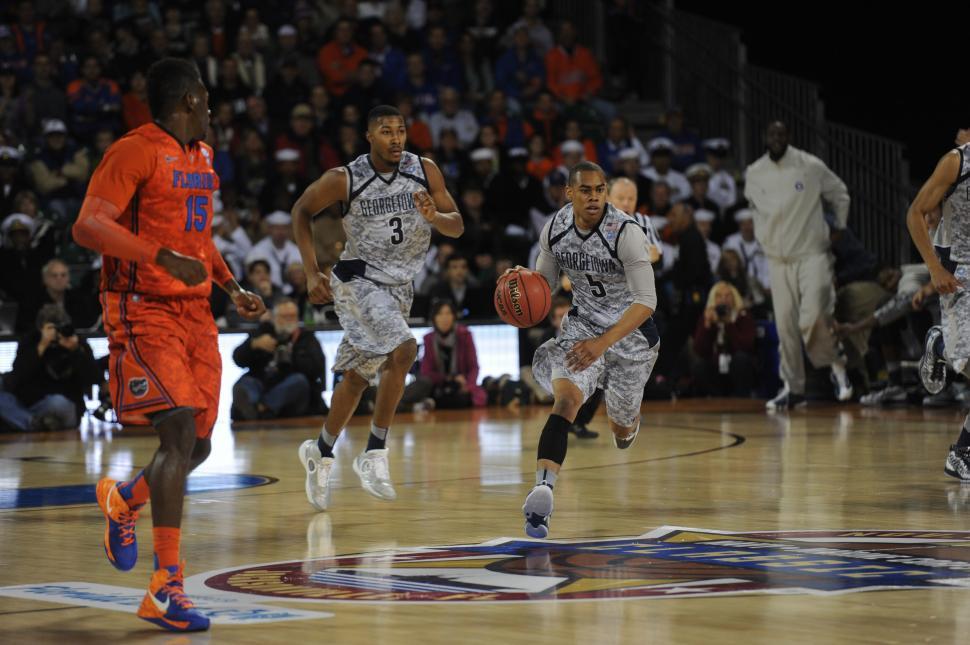 Free Image of Men Playing a Game of Basketball 