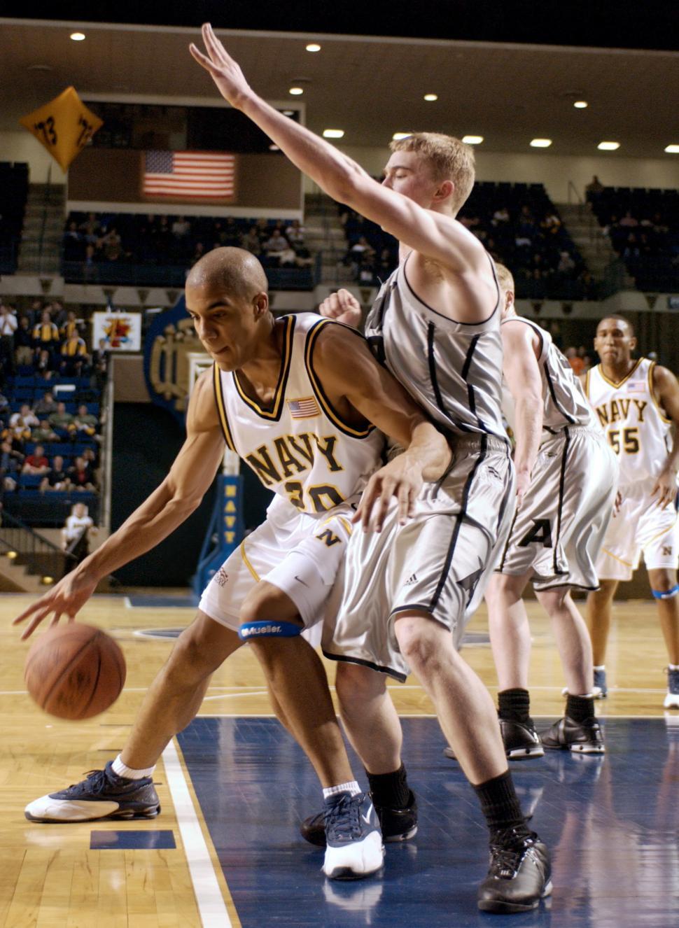 Free Image of Group of Men Playing a Game of Basketball 