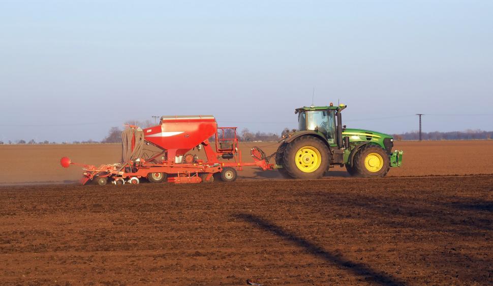 Free Image of Tractor Plowing Field With Trailer 