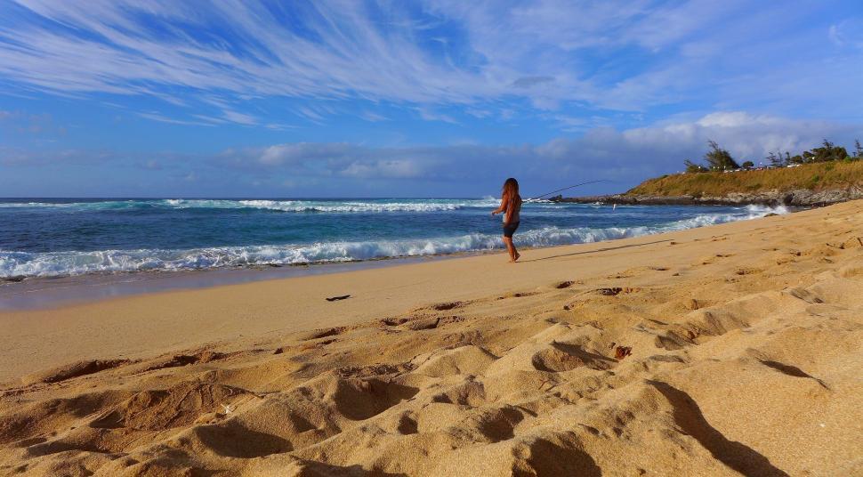Free Image of Person Walking on Beach by Ocean 