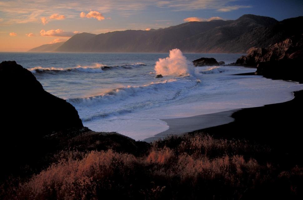 Free Image of Wave Crashing Into Shore of Beach 