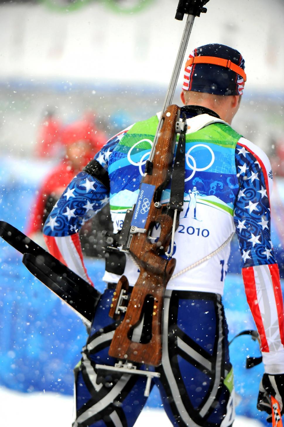Free Image of Man Holding Rifle in Snow 