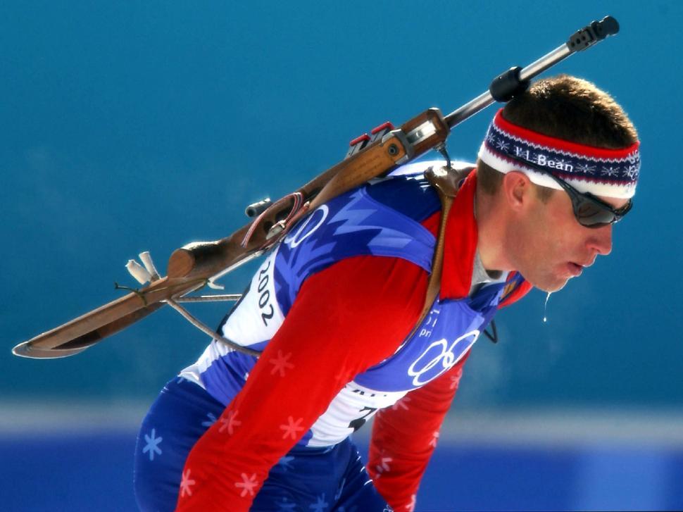 Free Image of Man Carrying Skis and Ski Poles 