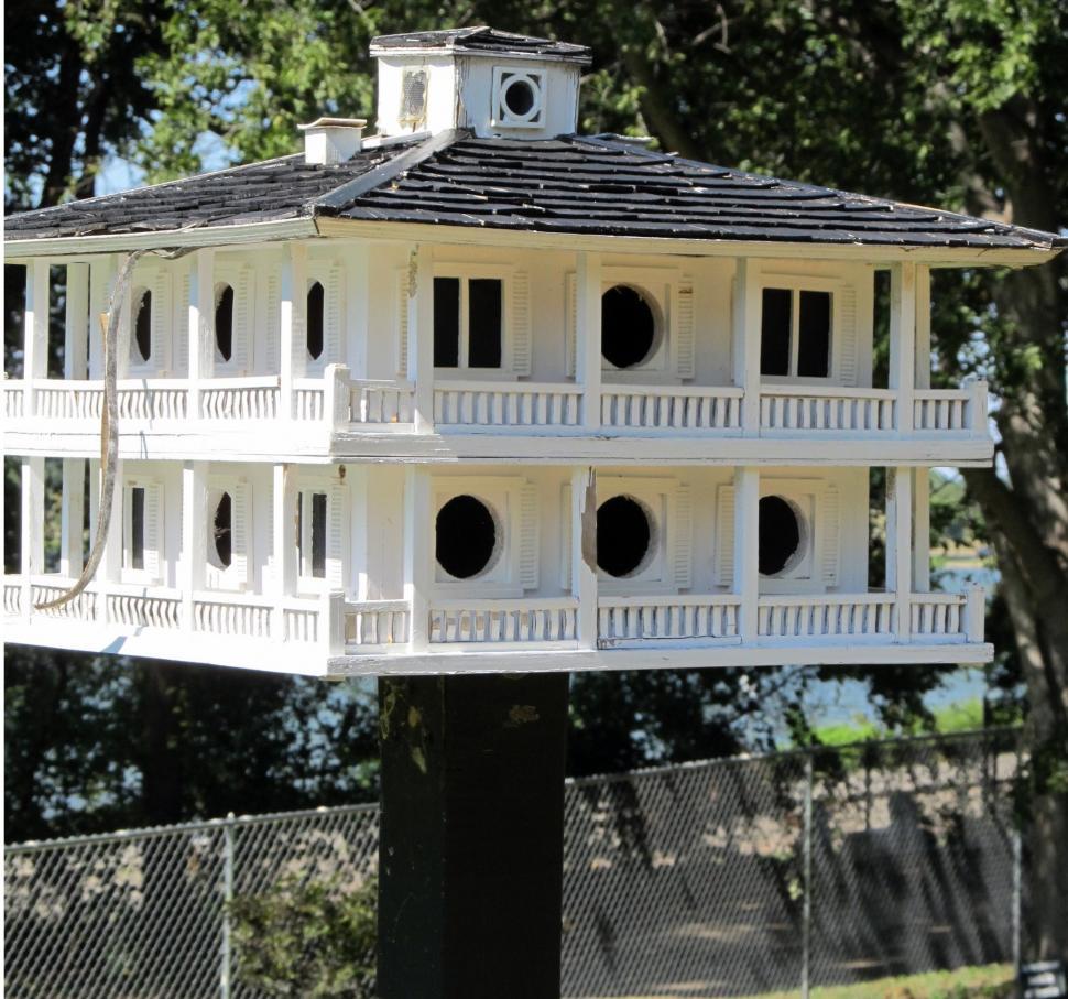 Free Image of White Bird House on Black Post 