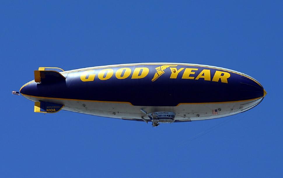 Free Image of Large Airplane Flying Through Blue Sky 