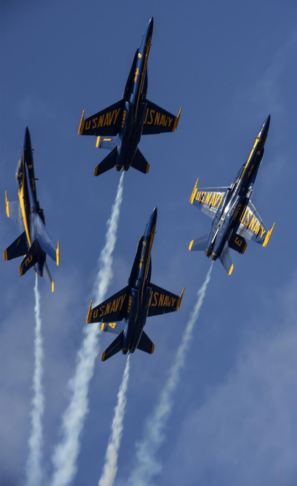 Free Image of Fighter Jets Flying Through a Blue Sky 