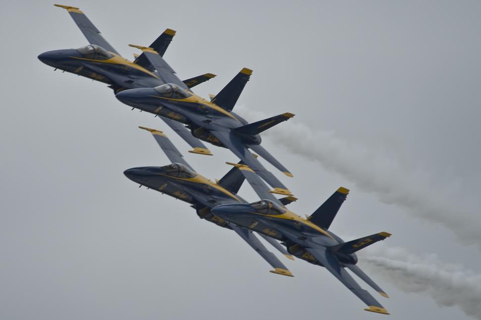 Free Image of Fighter Jets Flying Through Cloudy Sky 