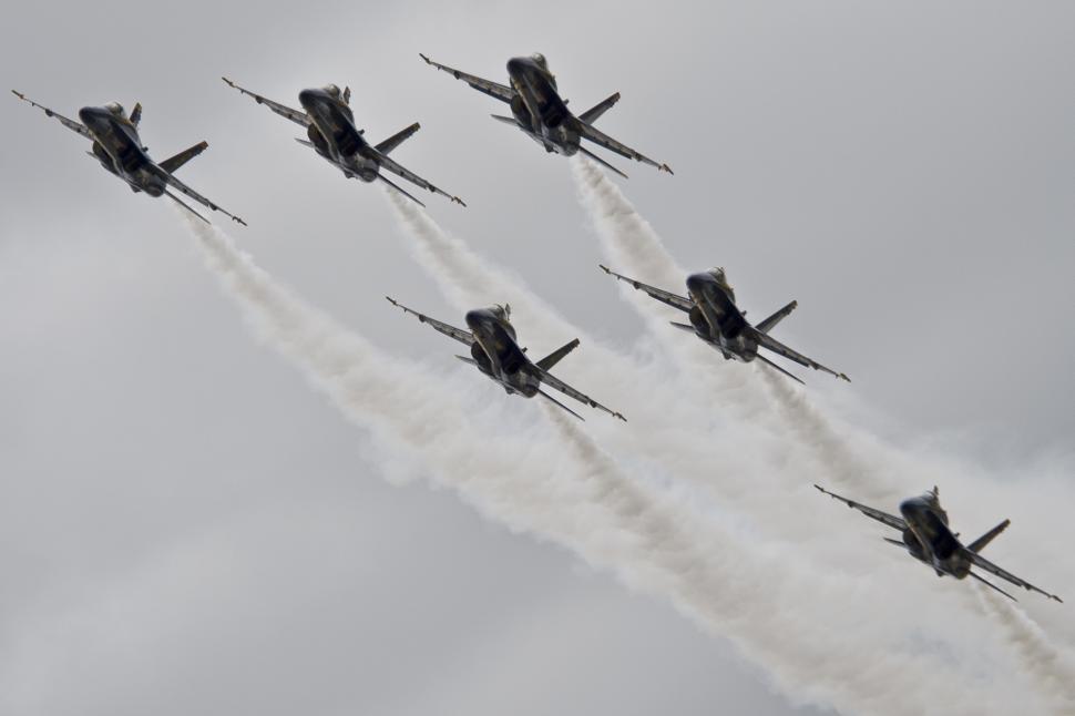 Free Image of Fighter Jets Flying Through Cloudy Sky 