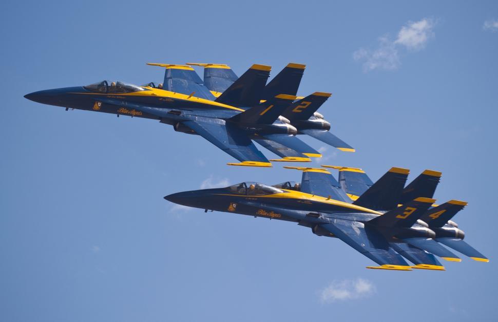 Free Image of Group of Fighter Jets Flying Through Blue Sky 
