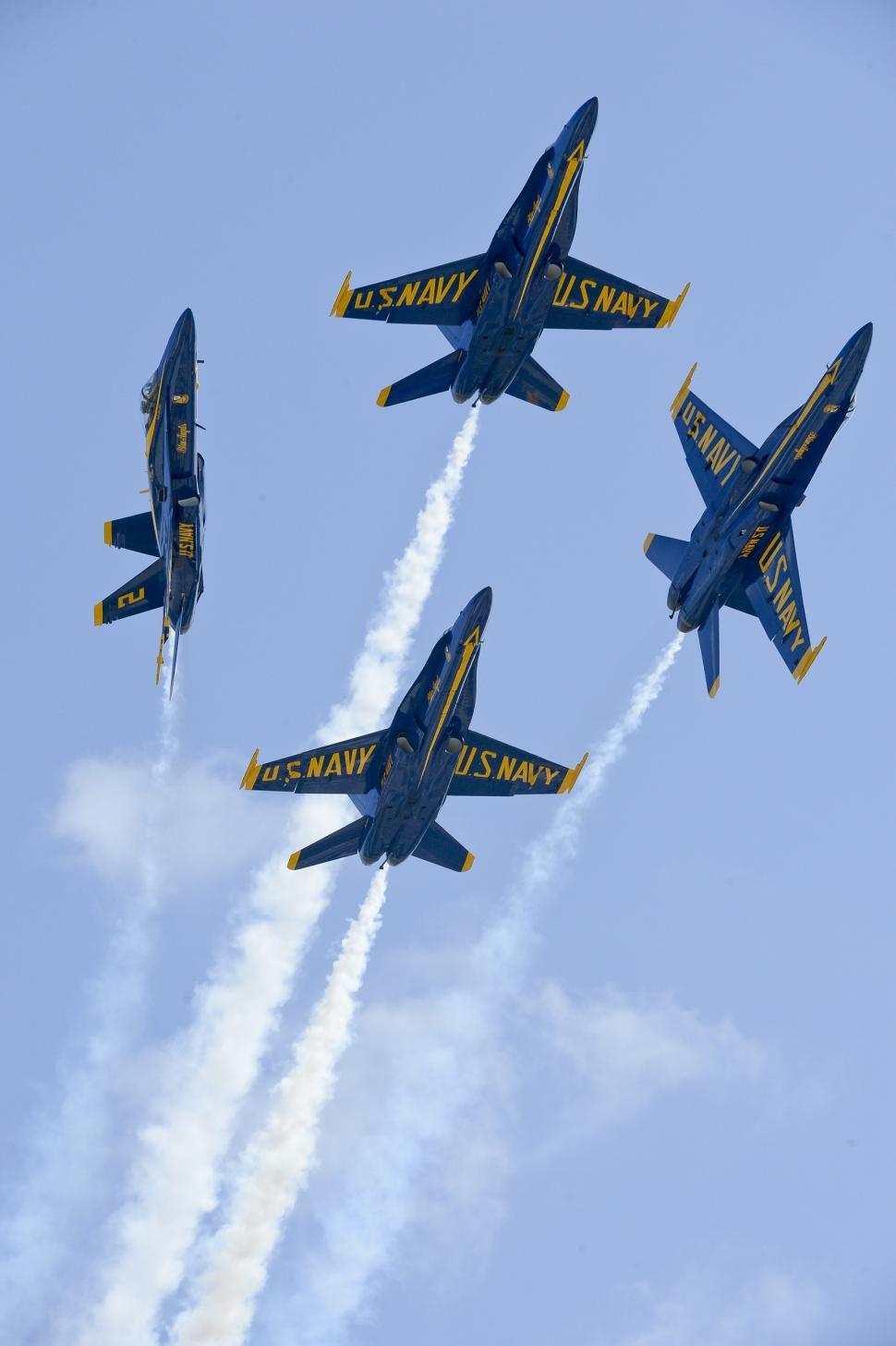 Free Image of Fighter Jets Flying Through Blue Sky 