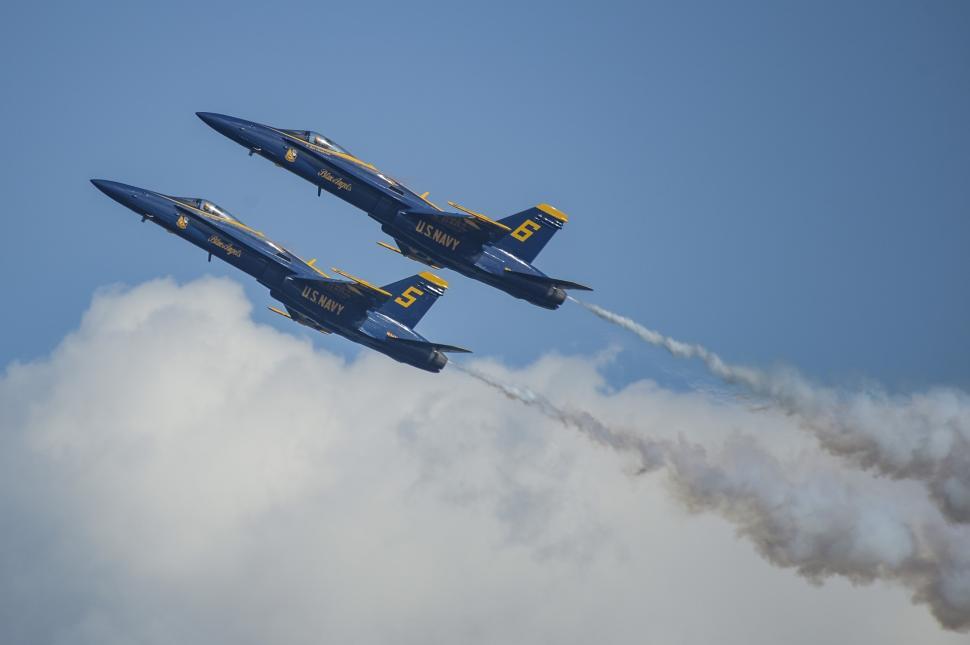 Free Image of Two Jets Flying in the Sky With Smoke Trails 