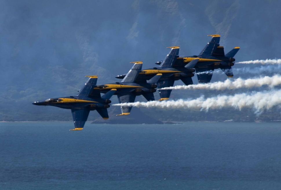 Free Image of Group of Fighter Jets Flying Through the Air 