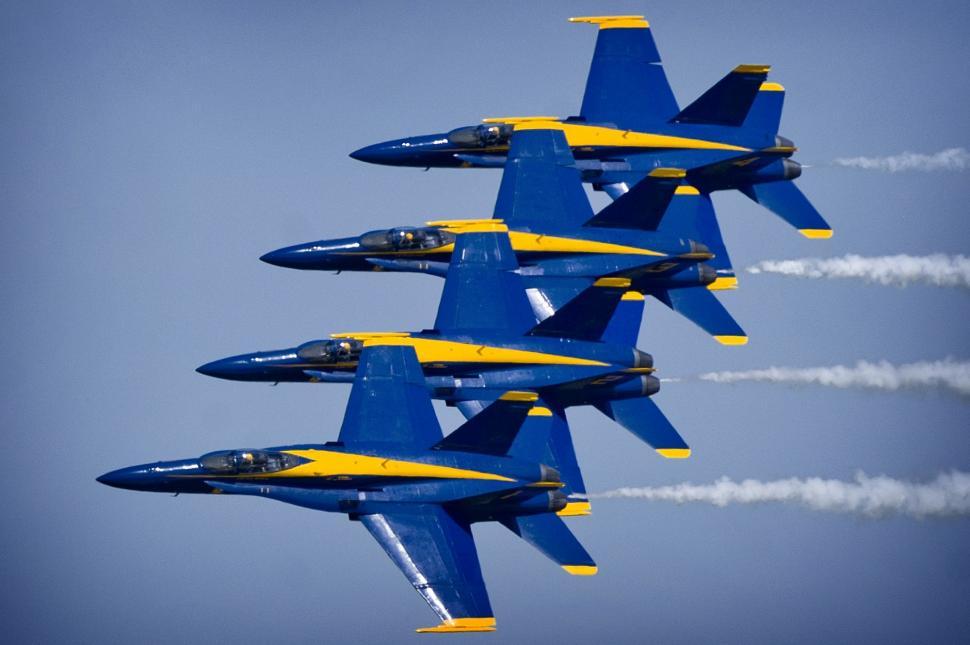 Free Image of Group of Fighter Jets Flying Through Blue Sky 